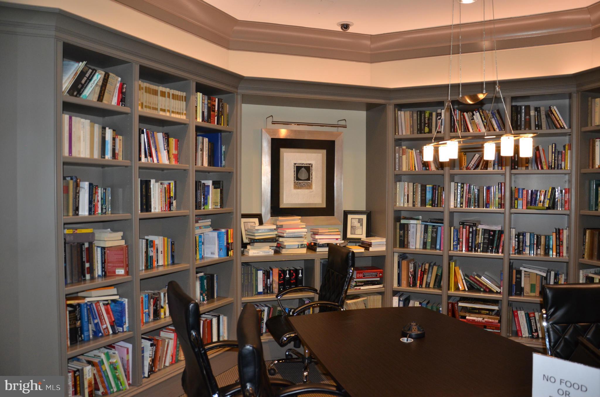 851 North Glebe Road, Unit 1116 Arlington, VA 22203 - Photo 5 of 30 a view of a workspace with bookshelf