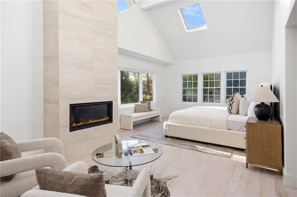 a view of a brick house with large windows