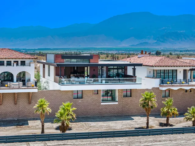 a kitchen with stainless steel appliances a refrigerator and a fireplace