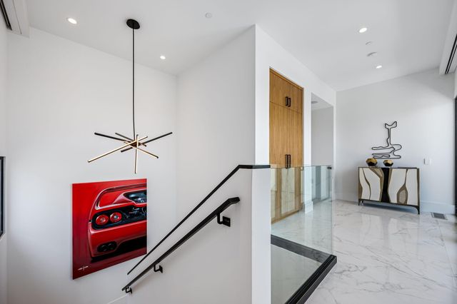 a bathroom with a granite countertop sink a mirror and shower