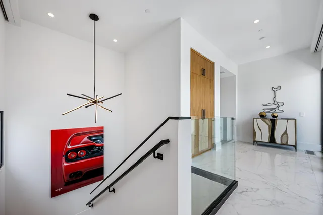a bathroom with a granite countertop sink a mirror and shower