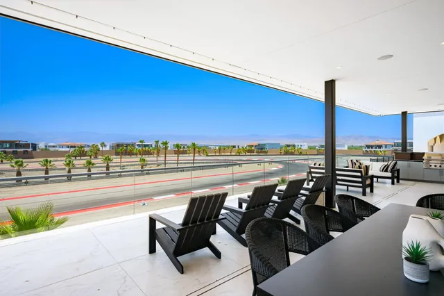 a bathroom with a bathtub a mirror a sink and a window