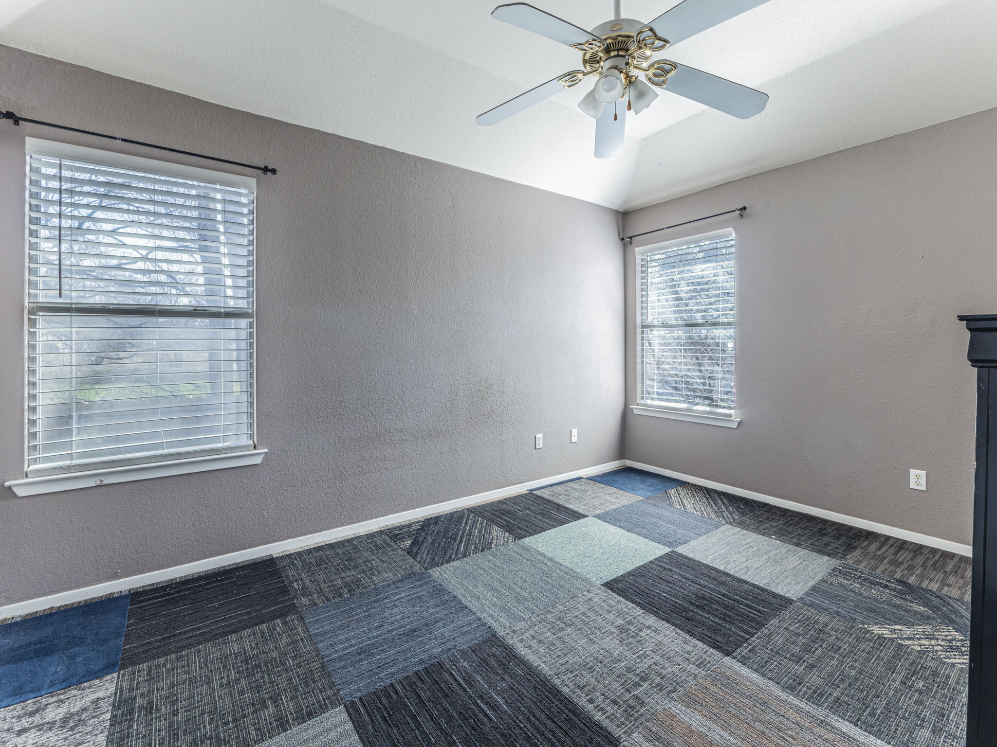 909 West Rundberg Lane Austin, TX 78758 - Photo 11 of 16 a view of an empty room with a chandelier fan and a window