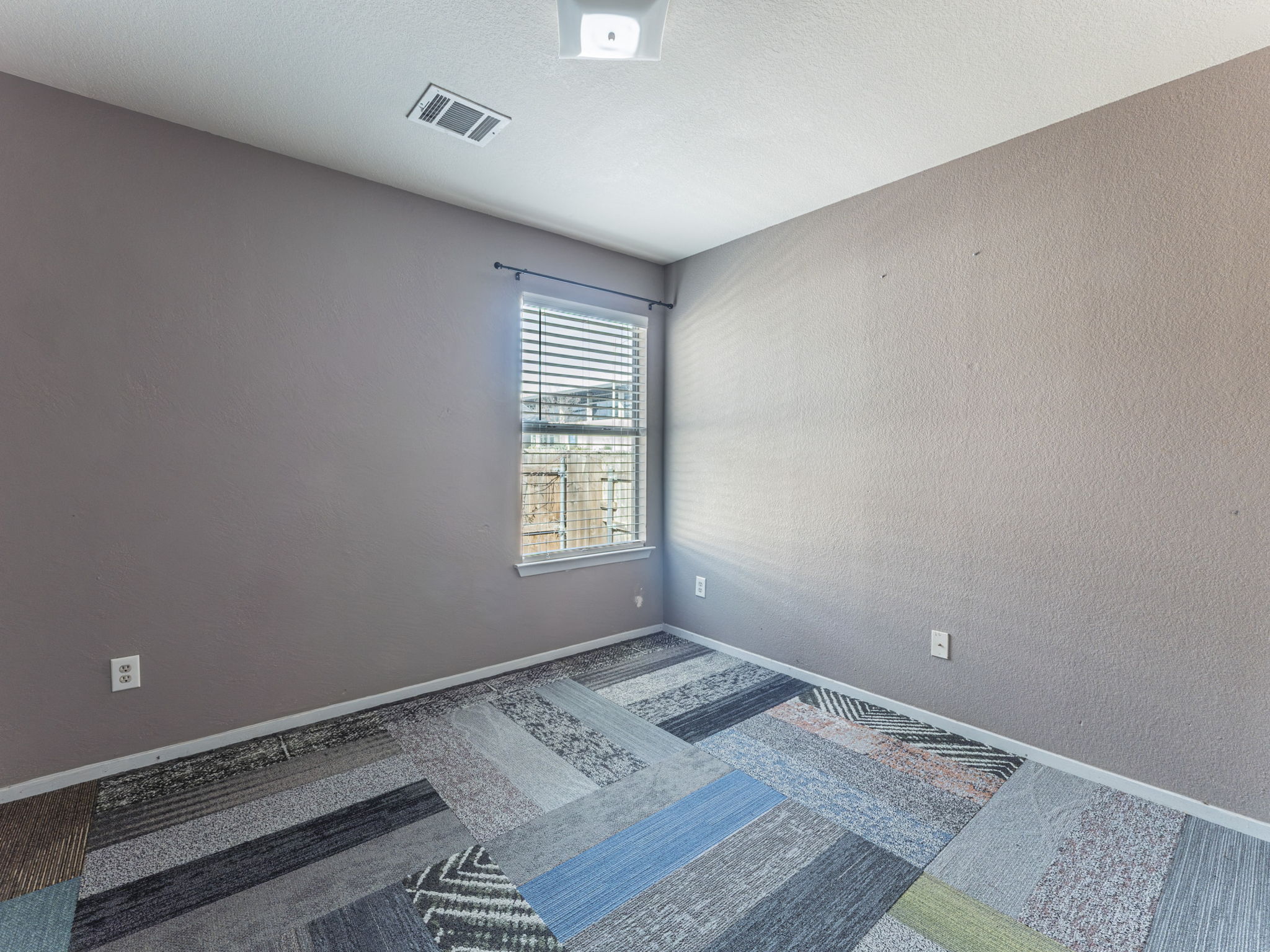 909 West Rundberg Lane Austin, TX 78758 - Photo 12 of 16 a view of a room with wooden floor and window