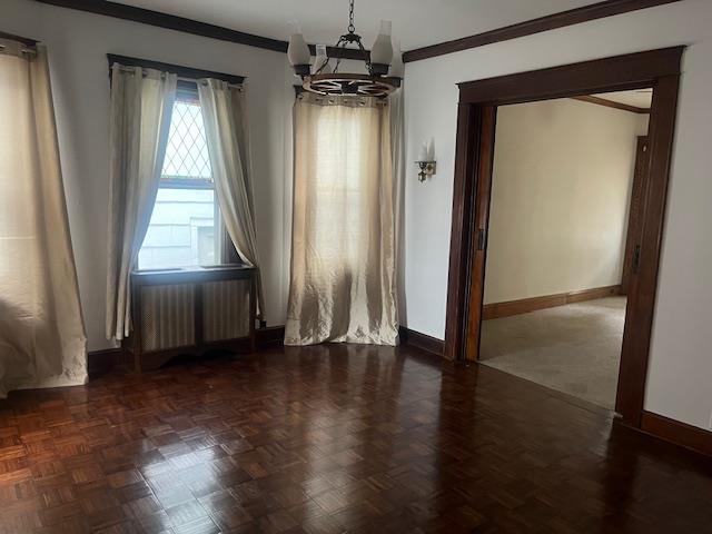 85-33 112th Street Queens, NY 11418 - Photo 5 of 15 an empty room with wooden floor and a window