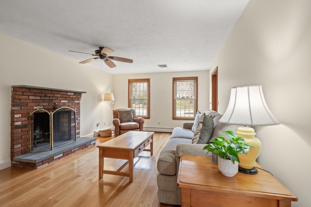 3 Daniels Road Mendon, MA 01756 - Photo 17 of 42 a living room with furniture fireplace and potted plant