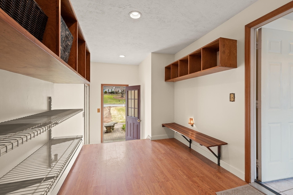 3 Daniels Road Mendon, MA 01756 - Photo 19 of 42 a view of a hallway with wooden floor and staircase