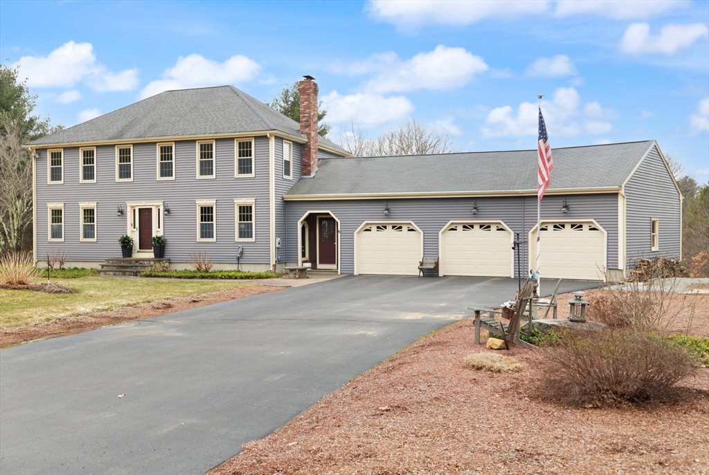 3 Daniels Road Mendon, MA 01756 - Photo 2 of 42 a front view of a house with a yard