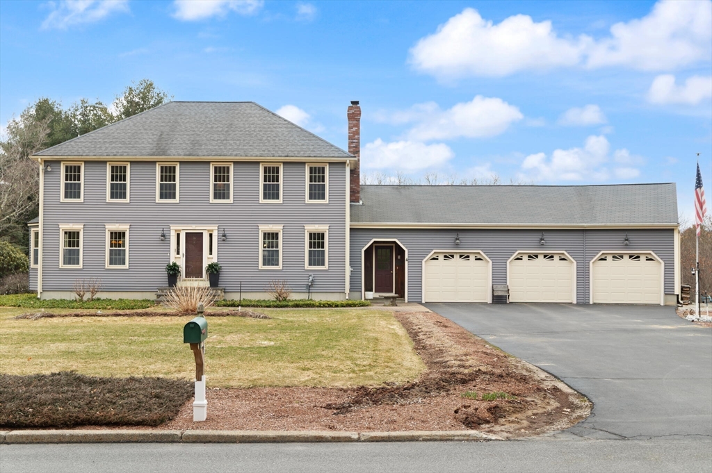 3 Daniels Road Mendon, MA 01756 - Photo 3 of 42 a front view of a house with garden