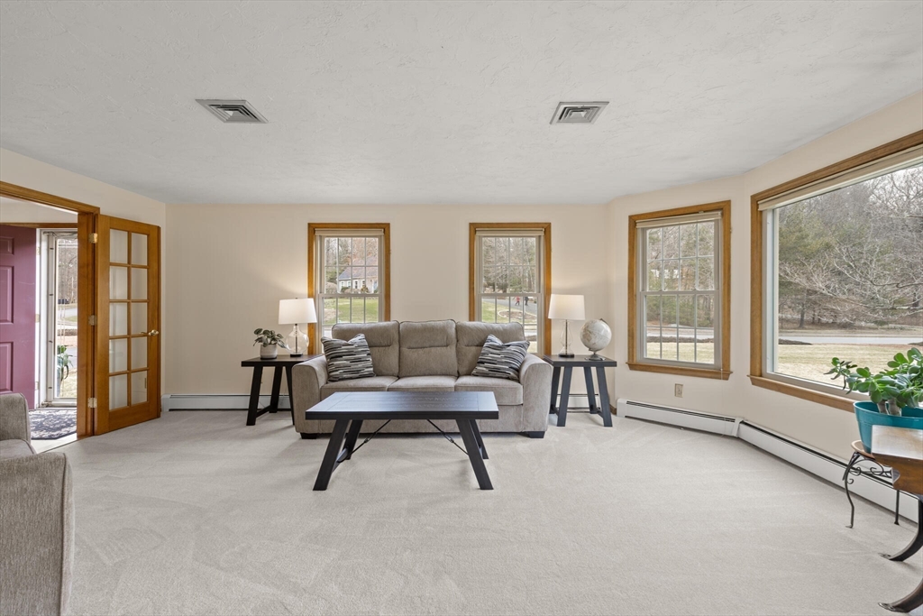 3 Daniels Road Mendon, MA 01756 - Photo 5 of 42 a view of a livingroom with furniture and windows