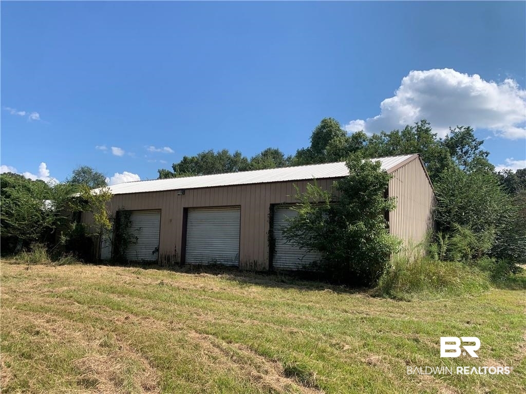 12751 Creel Road Grand Bay, AL 36541 - Photo 2 of 2 Garage with a yard