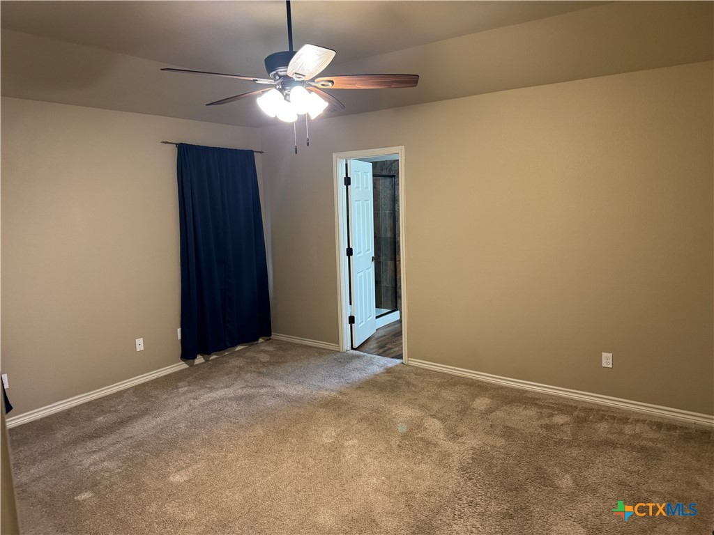 8811 Key Stone Temple, TX 76502 - Photo 13 of 22 an empty room with a chandelier fan and closet