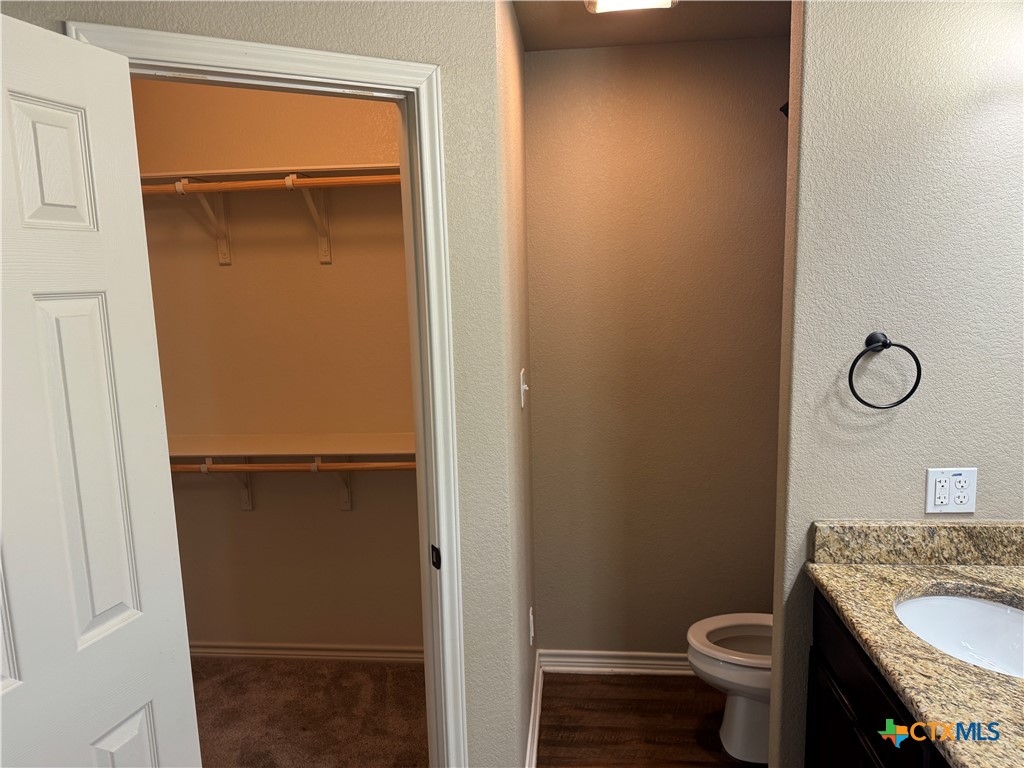 8811 Key Stone Temple, TX 76502 - Photo 19 of 22 a bathroom with a granite countertop toilet and a sink