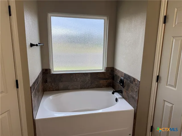 a bathroom with a bathtub