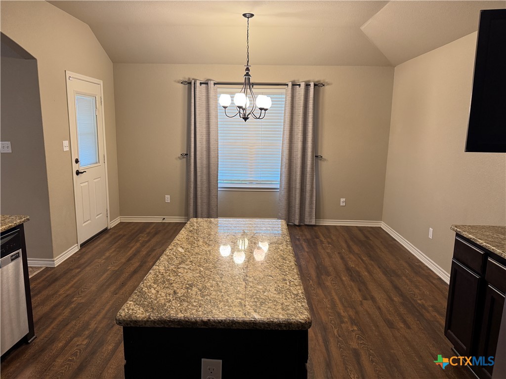 8811 Key Stone Temple, TX 76502 - Photo 3 of 22 a view of kitchen island with wooden floor and refrigerator
