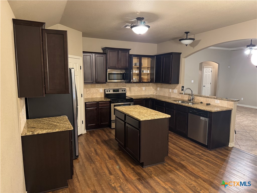 8811 Key Stone Temple, TX 76502 - Photo 4 of 22 a kitchen with a sink stove and refrigerator