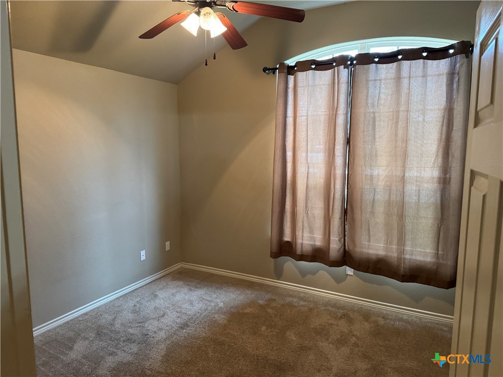 8811 Key Stone Temple, TX 76502 - Photo 7 of 22 a view of a room with a mirror and a shower curtain