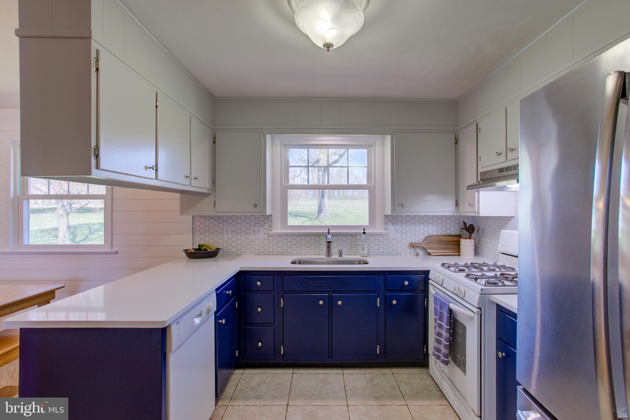 1853 Rockvale Road Lancaster, PA 17602 - Photo 15 of 43 a kitchen with a sink stove top oven and cabinets