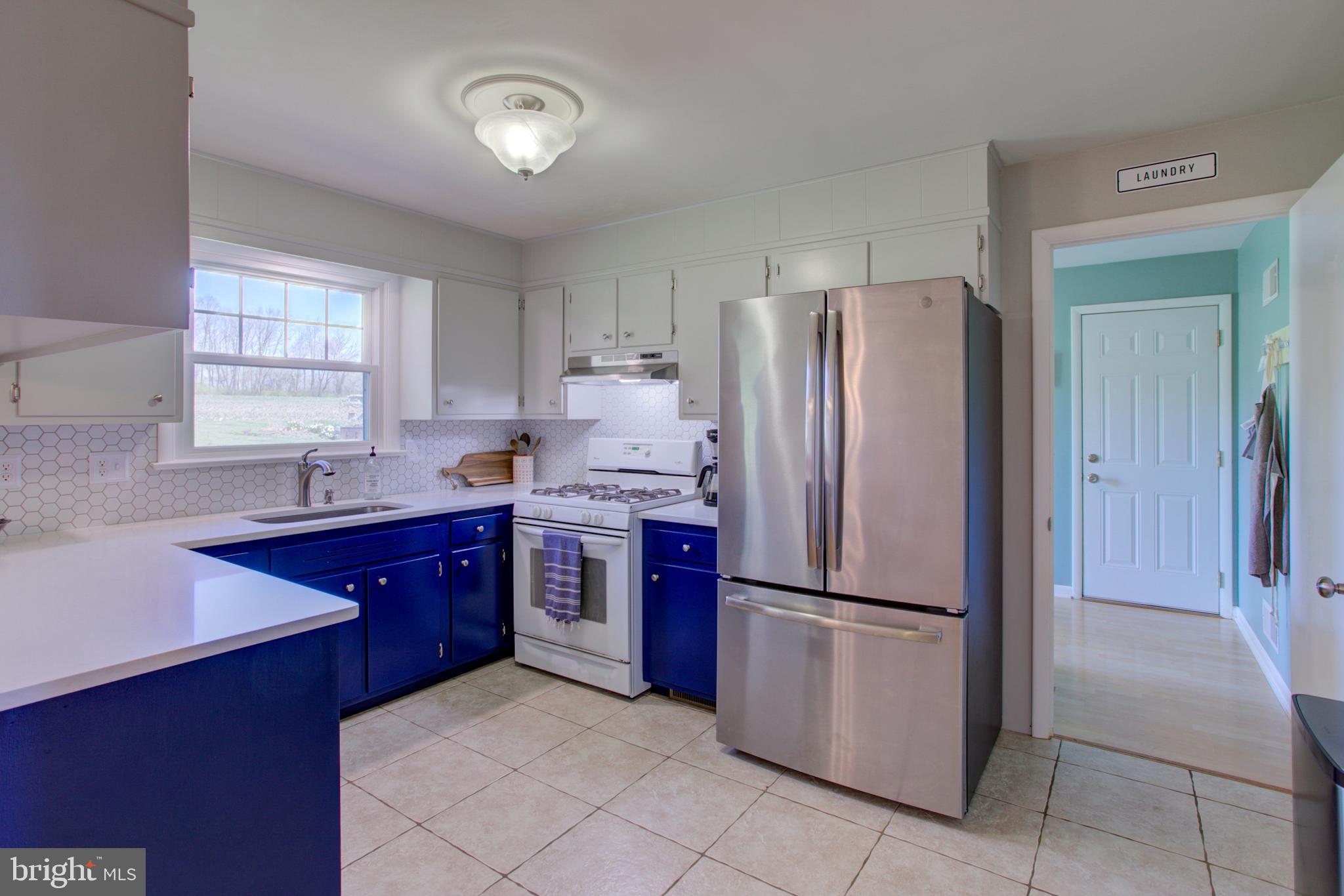 1853 Rockvale Road Lancaster, PA 17602 - Photo 18 of 43 a kitchen with stainless steel appliances granite countertop a refrigerator stove and sink