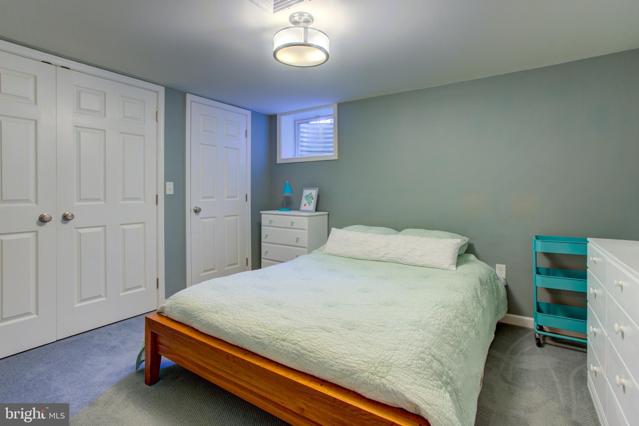 1853 Rockvale Road Lancaster, PA 17602 - Photo 22 of 43 a bedroom with a bed and a chandelier