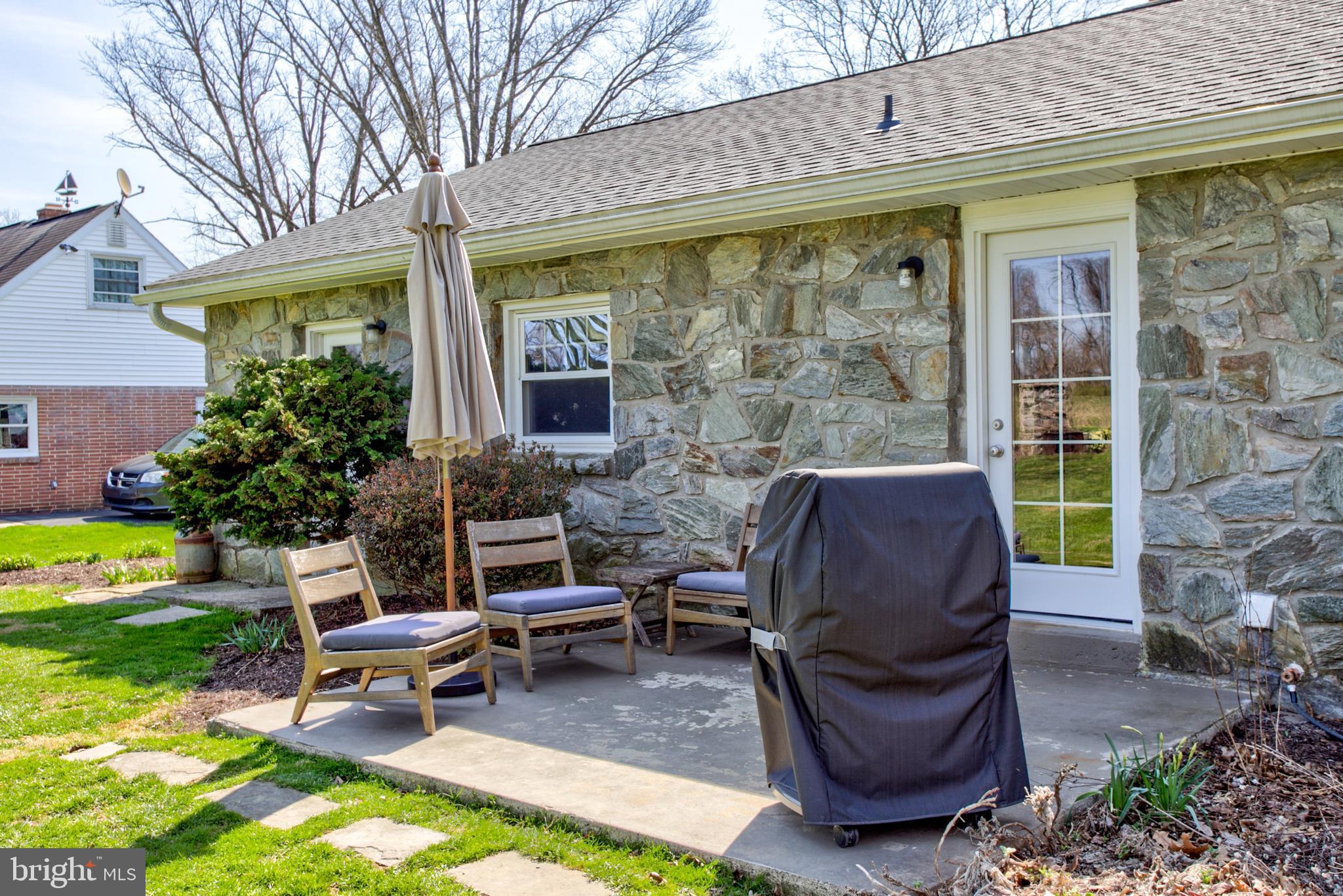 1853 Rockvale Road Lancaster, PA 17602 - Photo 34 of 43 a view of a patio with a table chairs and a yard