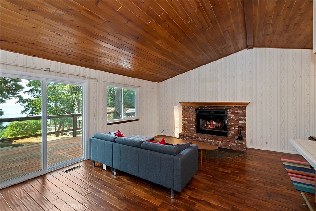 23919 Inspiration Crestline, CA 92325 - Photo 2 of 43 a living room with furniture and a fireplace