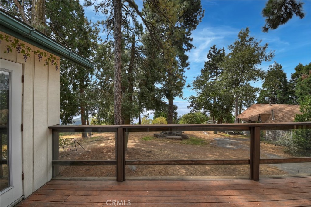 23919 Inspiration Crestline, CA 92325 - Photo 29 of 43 a view of backyard with wooden floor and outdoor seating