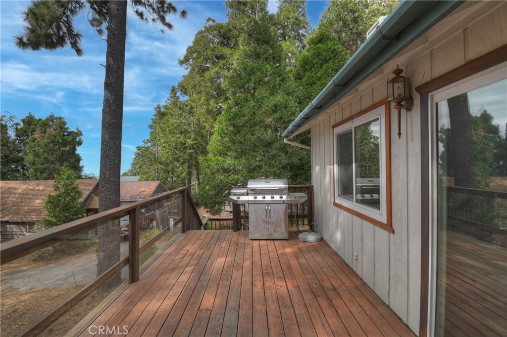 23919 Inspiration Crestline, CA 92325 - Photo 30 of 43 a view of a balcony with chair and wooden floor