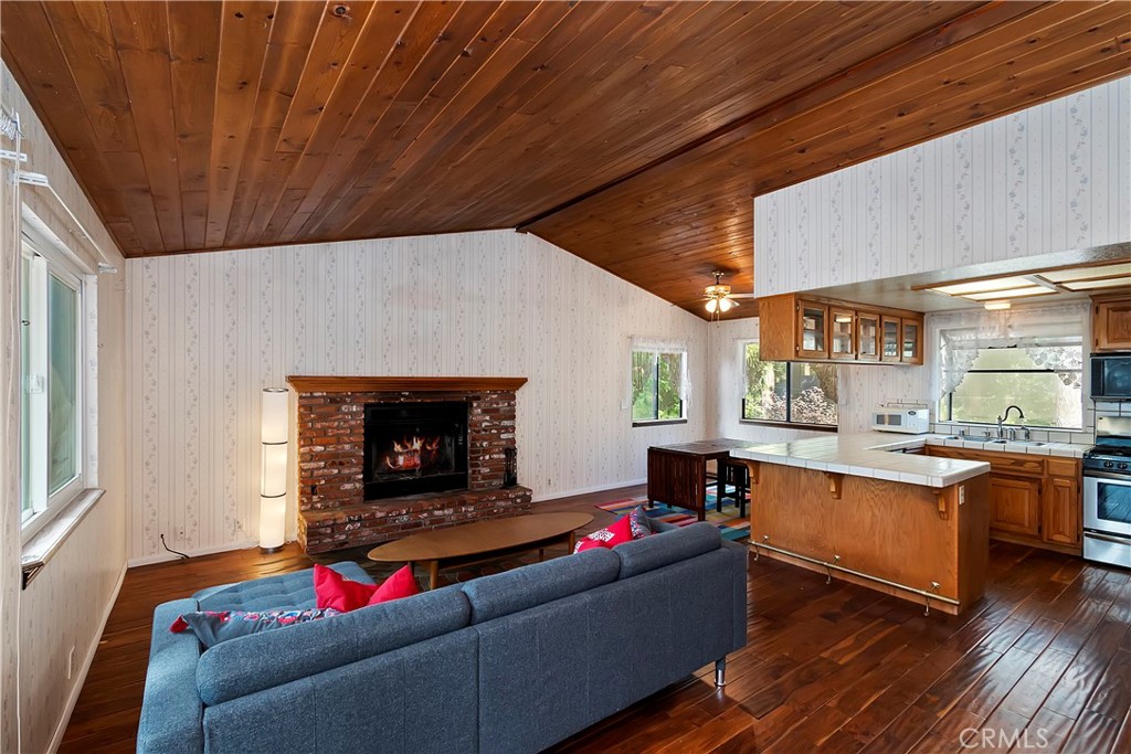23919 Inspiration Crestline, CA 92325 - Photo 3 of 43 a living room with furniture and a fireplace