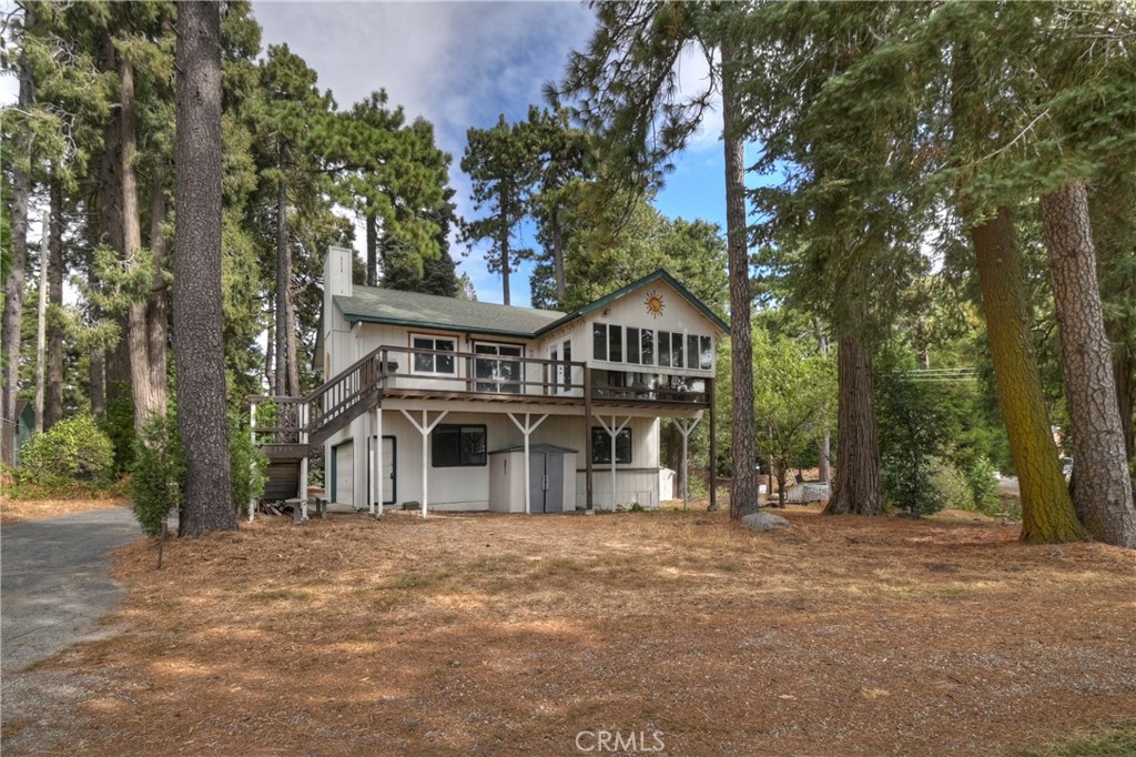 23919 Inspiration Crestline, CA 92325 - Photo 33 of 43 a front view of a house with a yard and garage