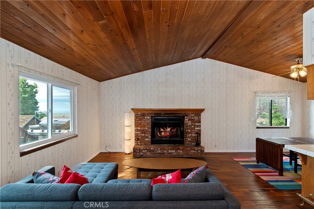 23919 Inspiration Crestline, CA 92325 - Photo 4 of 43 a living room with furniture and a fireplace