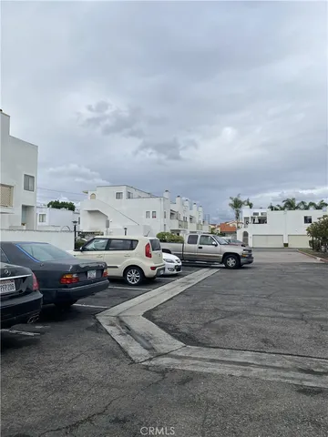 a view of parking with cars parked