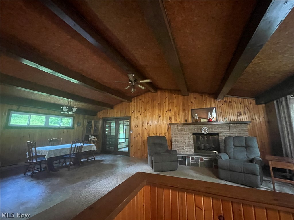 8915 Pioneer Road Byesville, OH 43723 - Photo 7 of 22 Living room, dining area with lofted ceiling with beams, and ceiling fan