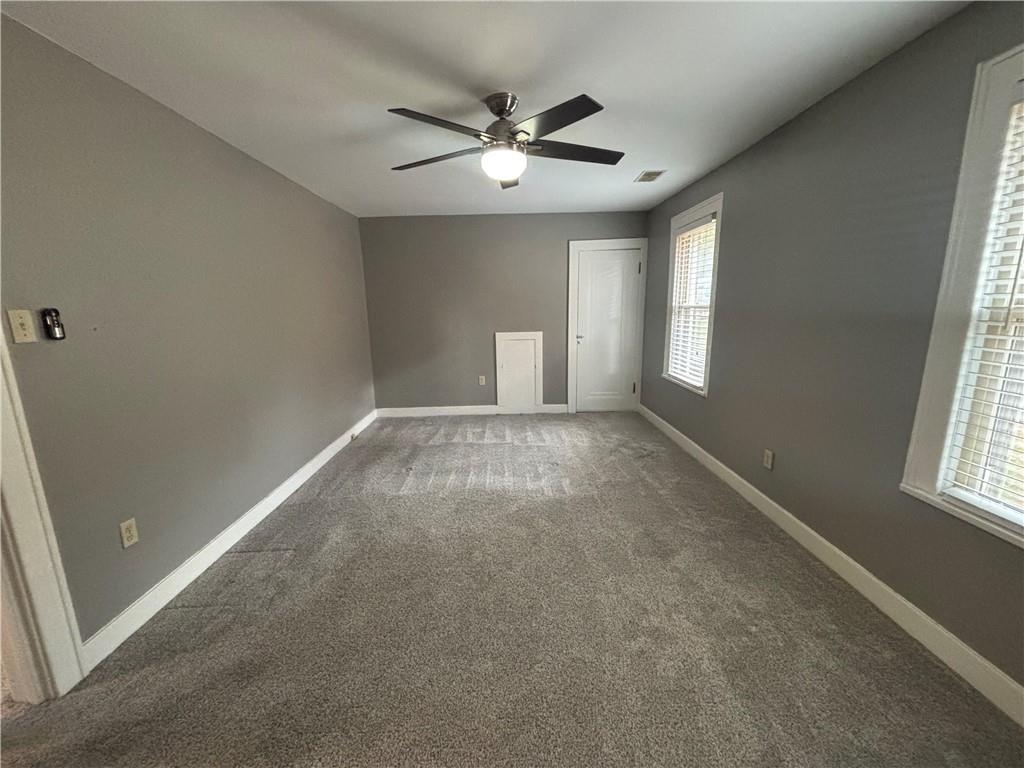 2662 Beaver Road Ambridge, PA 15003 - Photo 14 of 22 an empty room with windows and ceiling fan