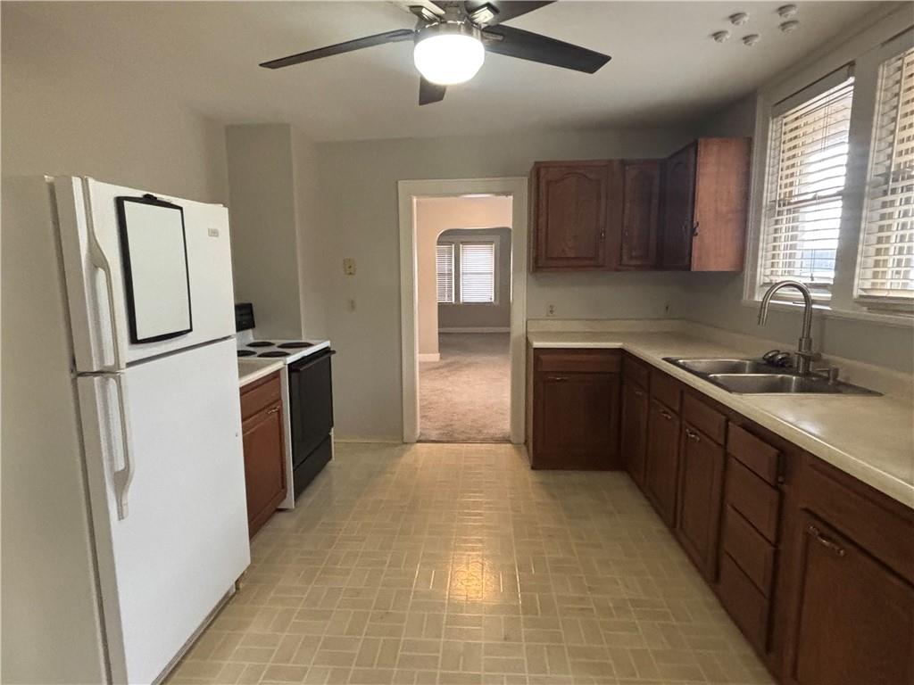 2662 Beaver Road Ambridge, PA 15003 - Photo 3 of 22 a kitchen with granite countertop a refrigerator and a sink