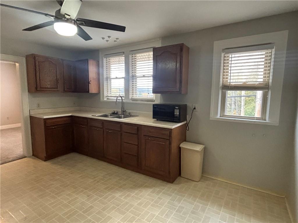 2662 Beaver Road Ambridge, PA 15003 - Photo 4 of 22 a kitchen with a sink cabinets and window