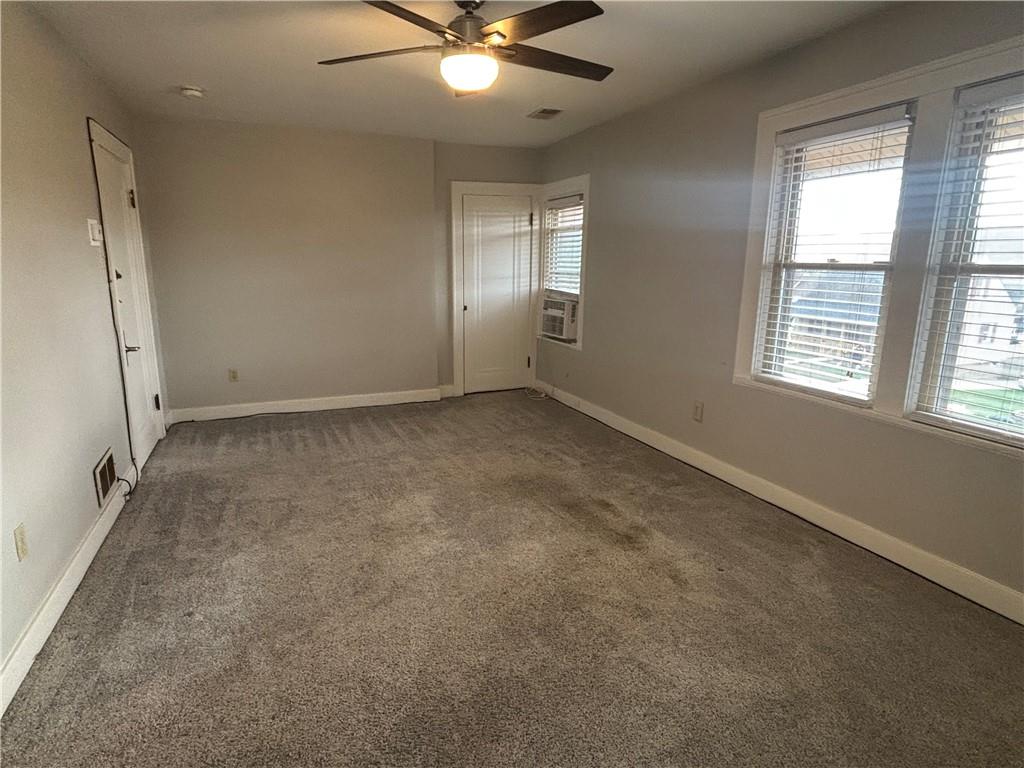 2662 Beaver Road Ambridge, PA 15003 - Photo 9 of 22 an empty room with windows and fan