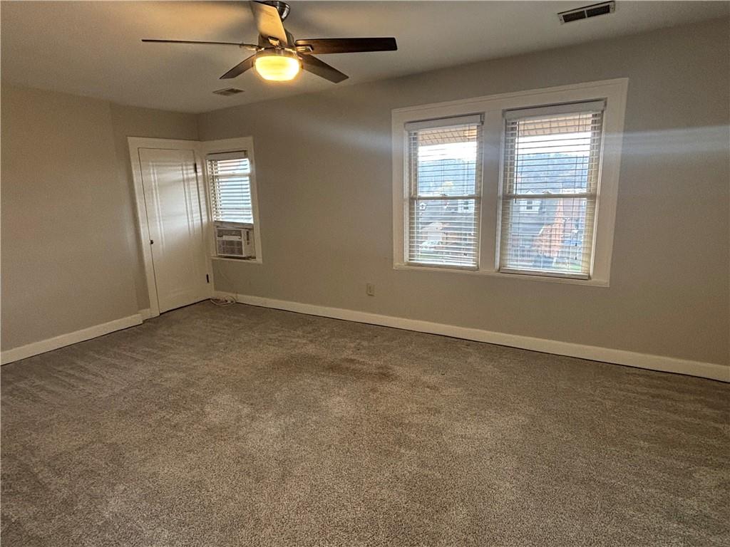 2662 Beaver Road Ambridge, PA 15003 - Photo 10 of 22 a view of an empty room with window and chandelier fan
