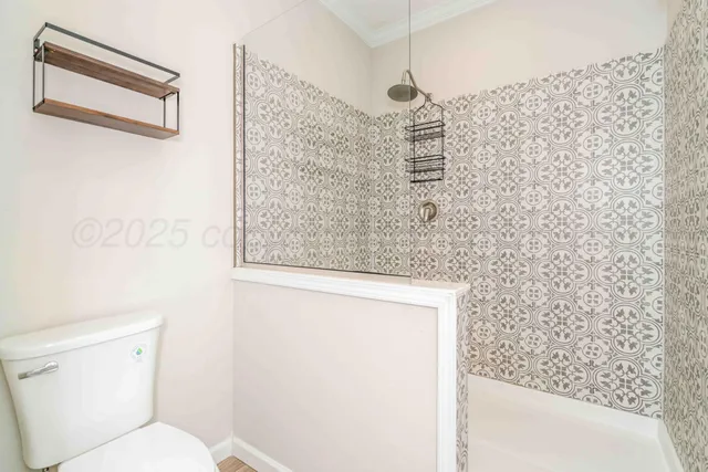 a kitchen with stainless steel appliances granite countertop a sink cabinets and wooden floor