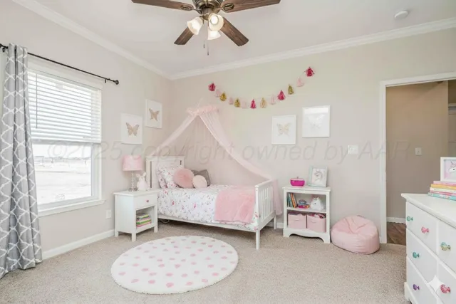 an empty room with chandelier fan