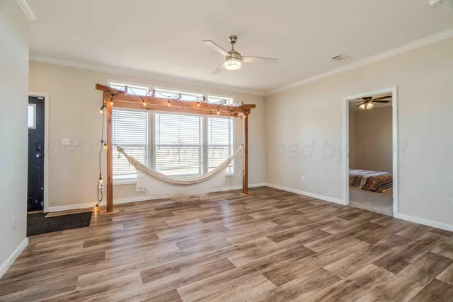 a view of a kitchen with wooden floor and a kitchen