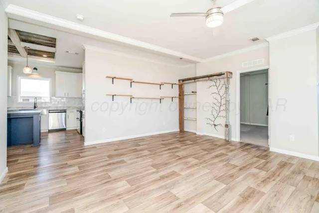 an empty room with a empty space and windows