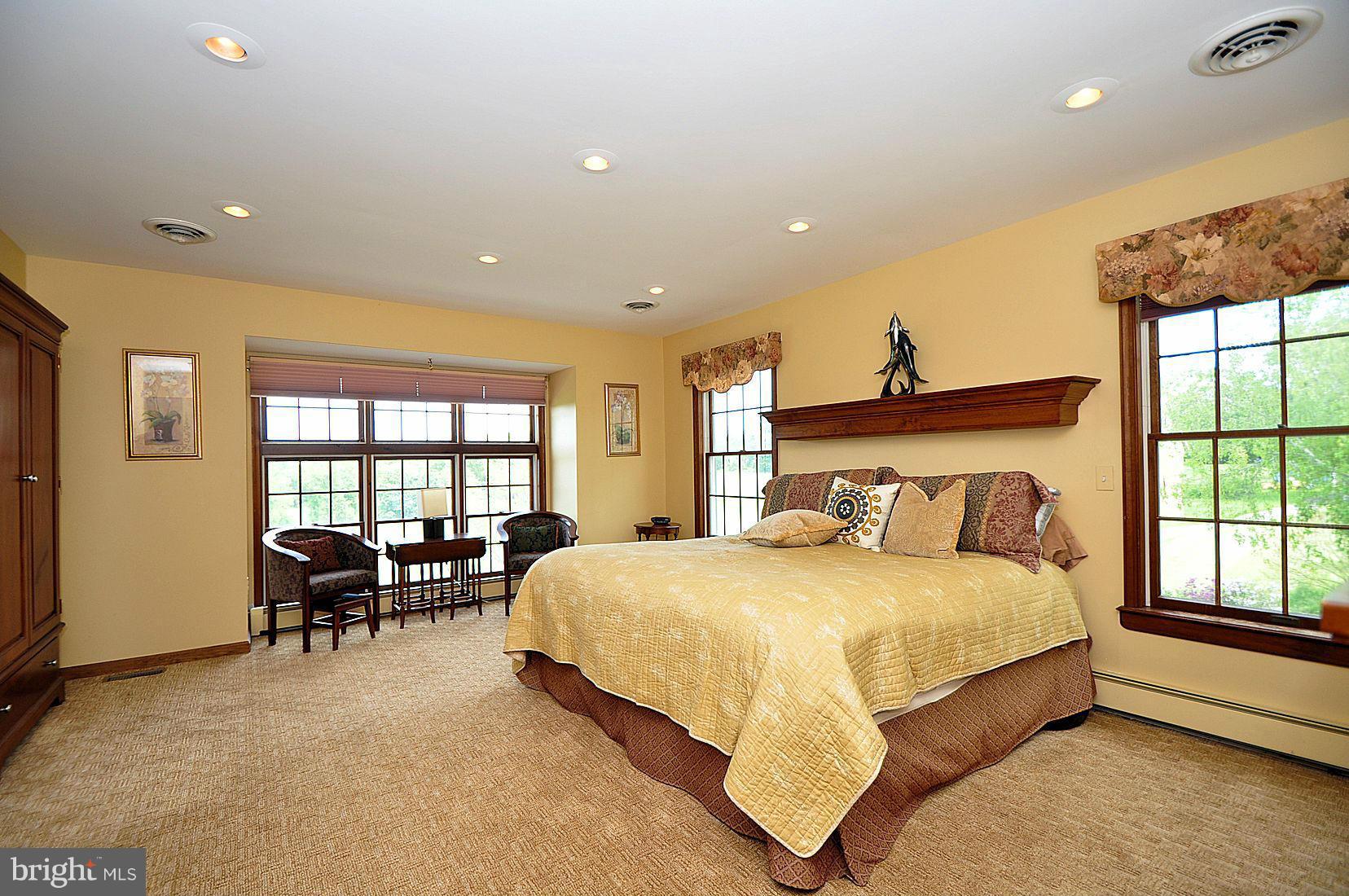 14829 Old Hanover Road Upperco, MD 21155 - Photo 14 of 30 a bedroom with a bed and a table