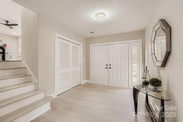 a view of an entryway with wooden floor