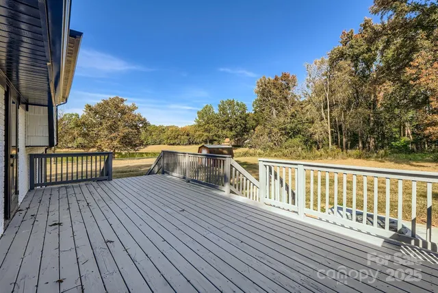 a view of deck with wooden floor and outdoor seating