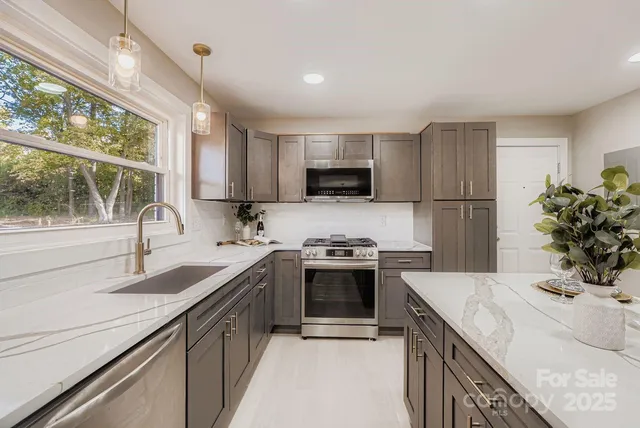 a kitchen with a sink stove and refrigerator