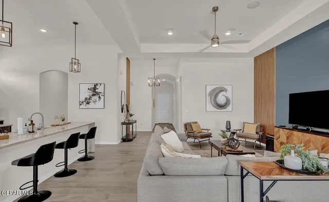 a living room with fireplace furniture and a flat screen tv