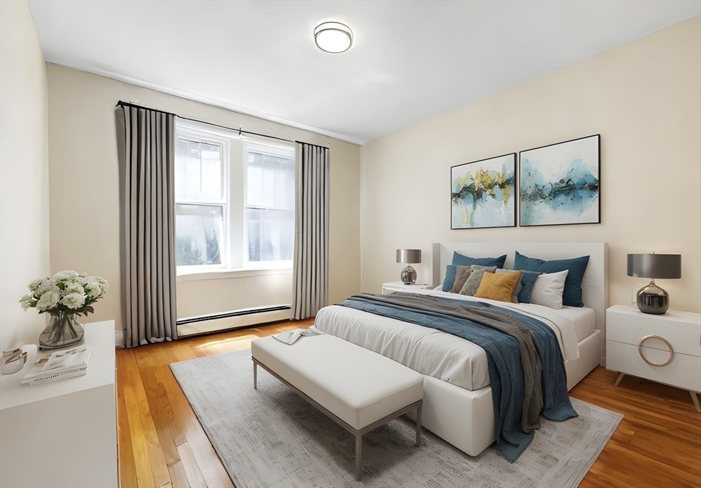 321 Tappan Street, Unit 2 Brookline, MA 02445 - Photo 12 of 25 a spacious bedroom with a bed and window