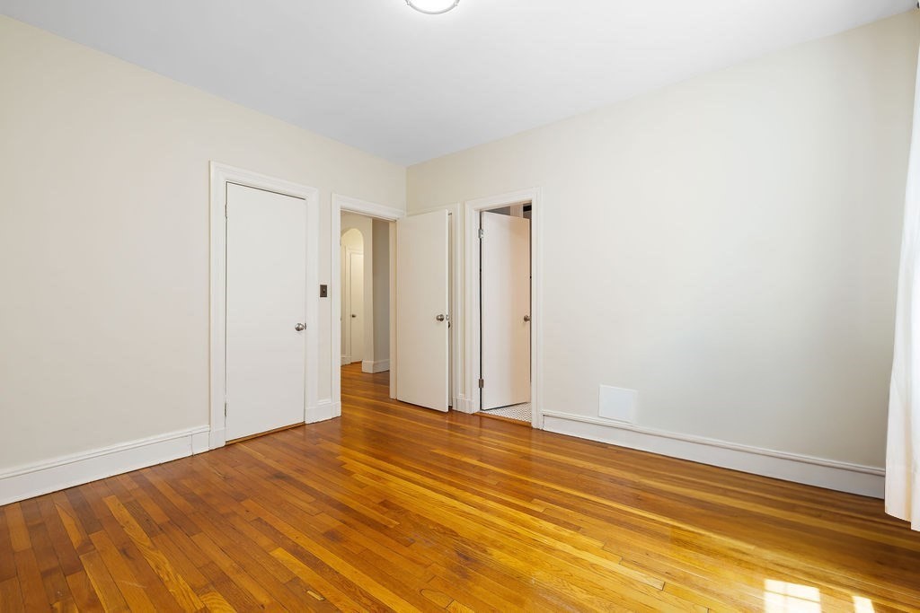 321 Tappan Street, Unit 2 Brookline, MA 02445 - Photo 14 of 25 a view of room with wooden floor