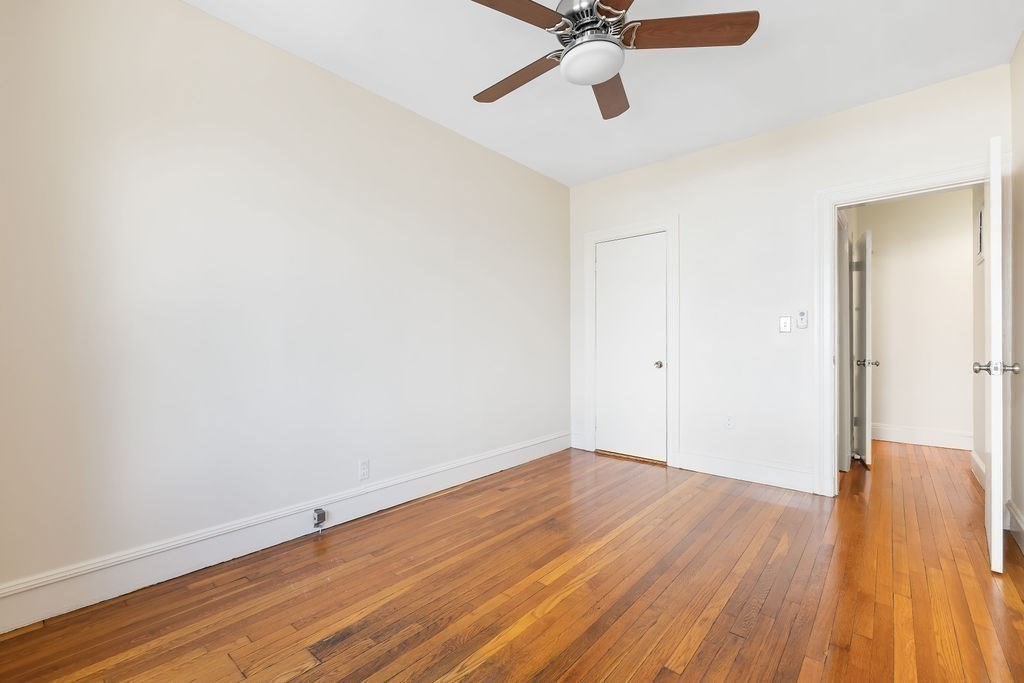 321 Tappan Street, Unit 2 Brookline, MA 02445 - Photo 18 of 25 a view of empty room with wooden floor